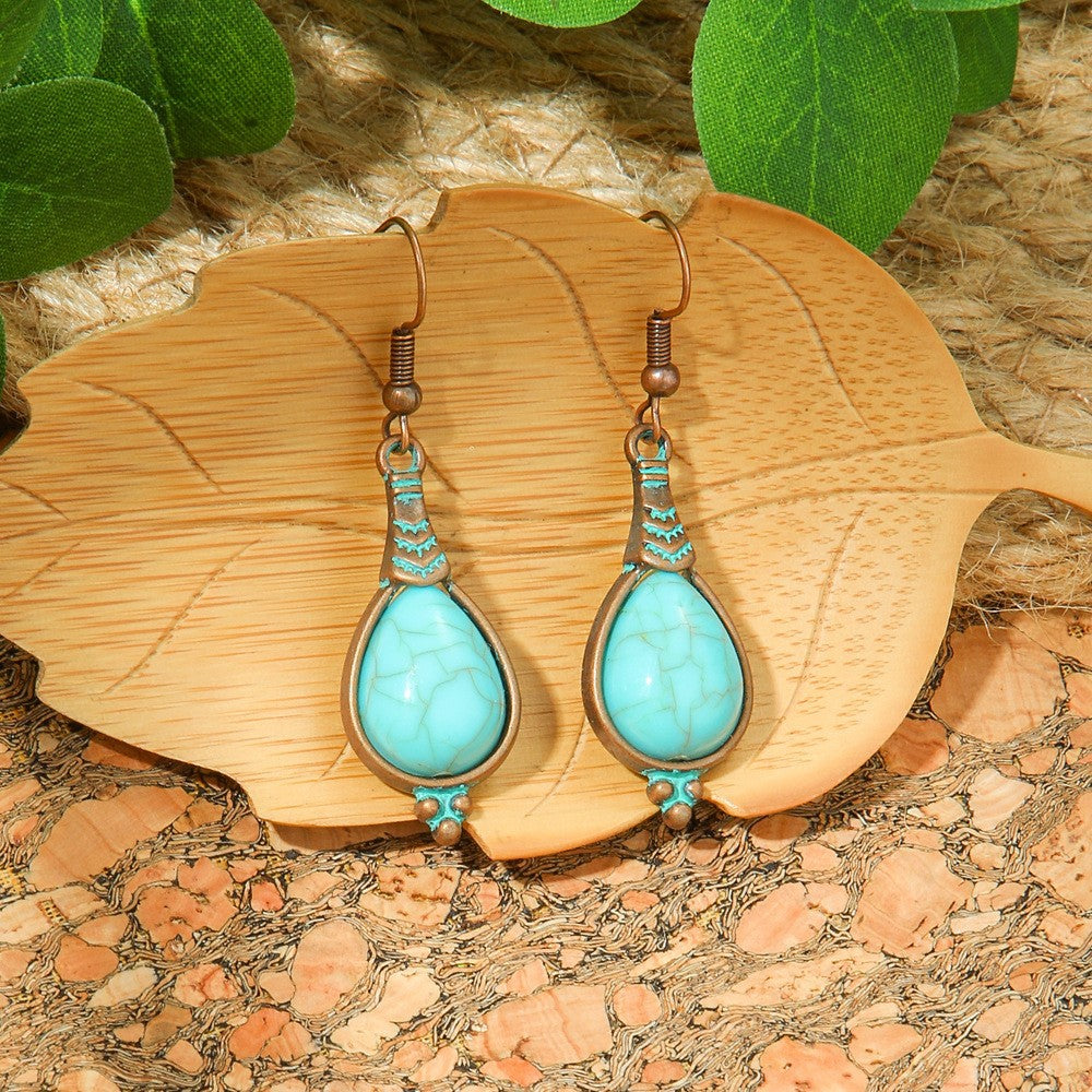 Wholesale Retro Bohemian Turquoise Heart Hollow Leaves Alloy Earrings for Party Wear Boutique Resale Jewelry