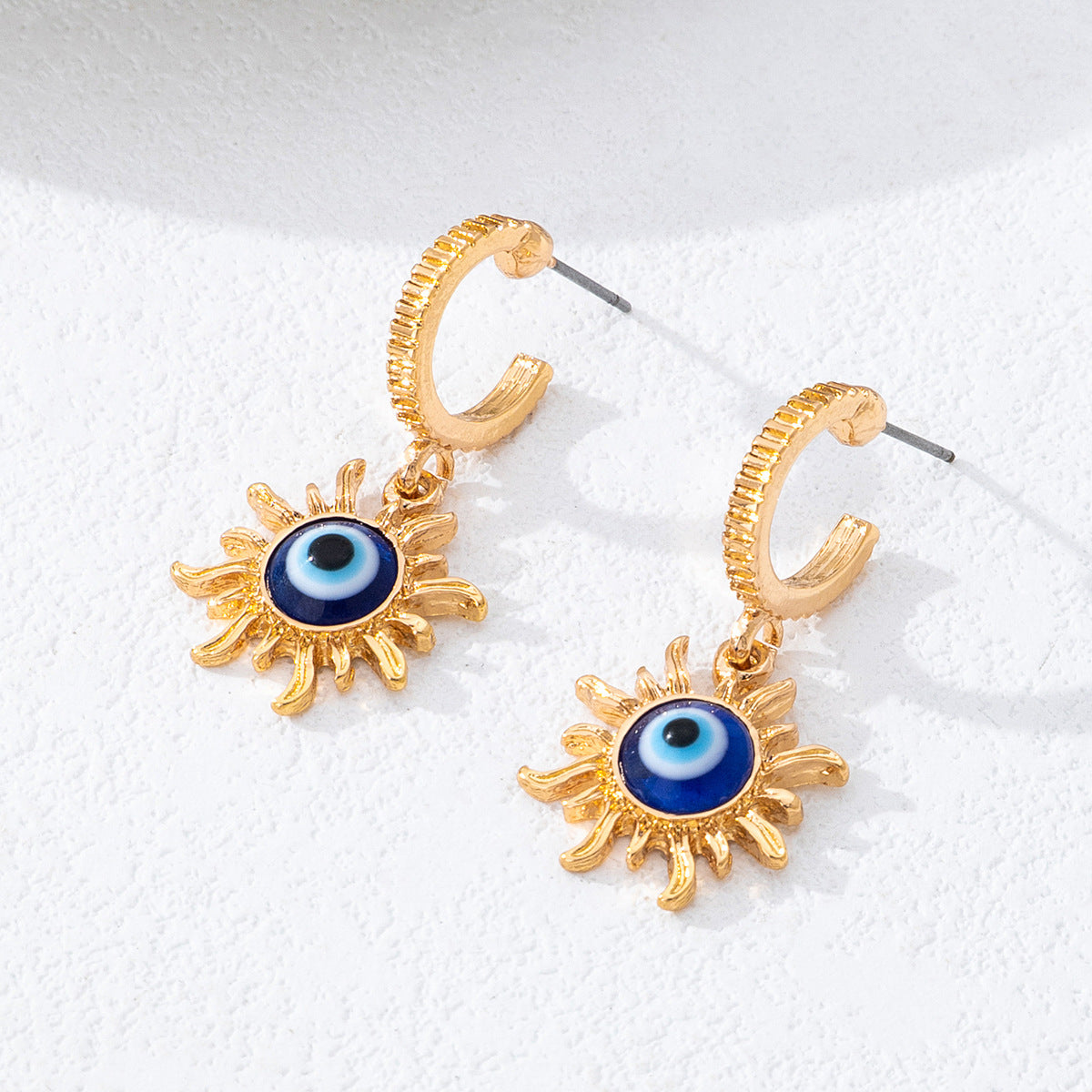 Wholesale zinc alloy drip-print devil eye earrings luxurious irregular eye earrings.