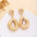 Wholesale Retro Flower Pearl Hollow Love Light Luxury Earrings