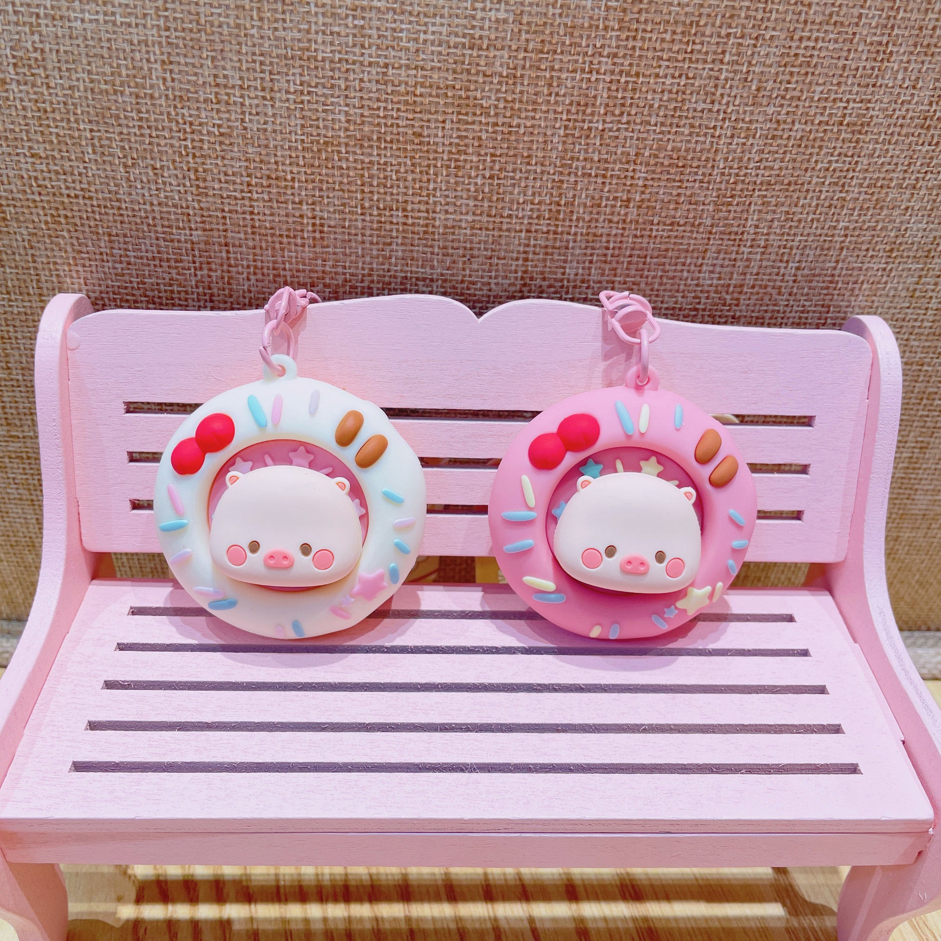 Wholesale Cute cartoon PVC pig spinning donut keychain