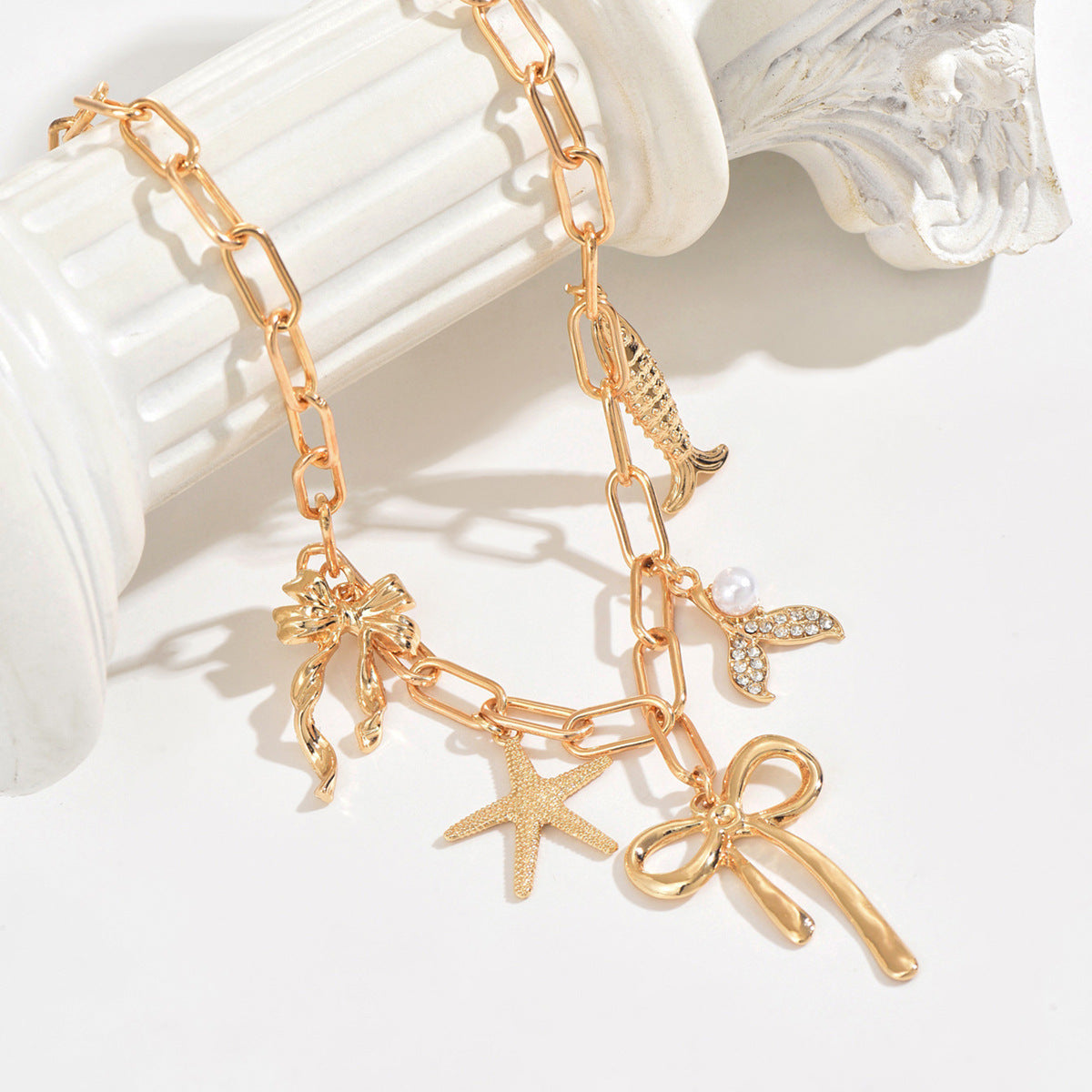 Wholesale diamond-encrusted fish tail five-pointed star  bow multi-pendant necklace