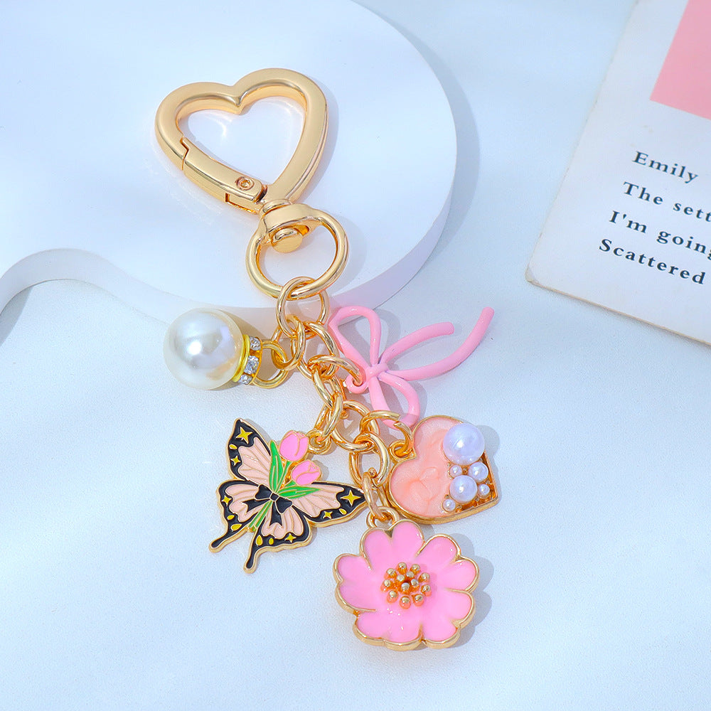 Wholesale Enamel Butterfly Flower Keychain with Pearl Pendant - Trendy Car Key Accessory
