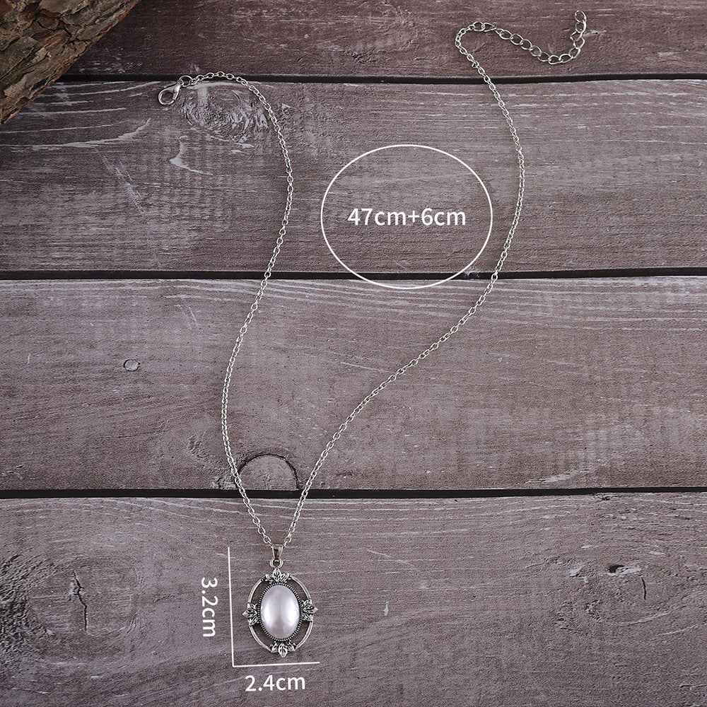 Wholesale Retro Hollow Bohemian Style Inlaid Oval Pearl Alloy Pendant Necklace