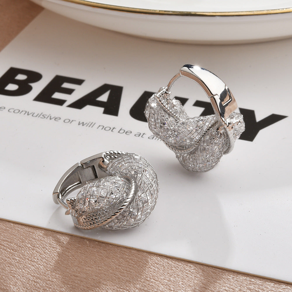 Wholesale Light luxury hollow twist earrings with glittering crystal wrap earrings