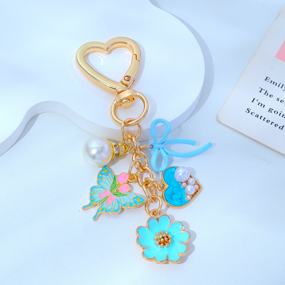 Wholesale Enamel Butterfly Flower Keychain with Pearl Pendant - Trendy Car Key Accessory