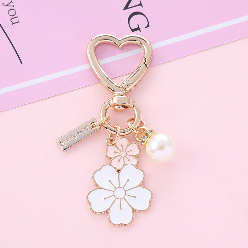 Wholesale two-color flower pearl alloy wrist keychain