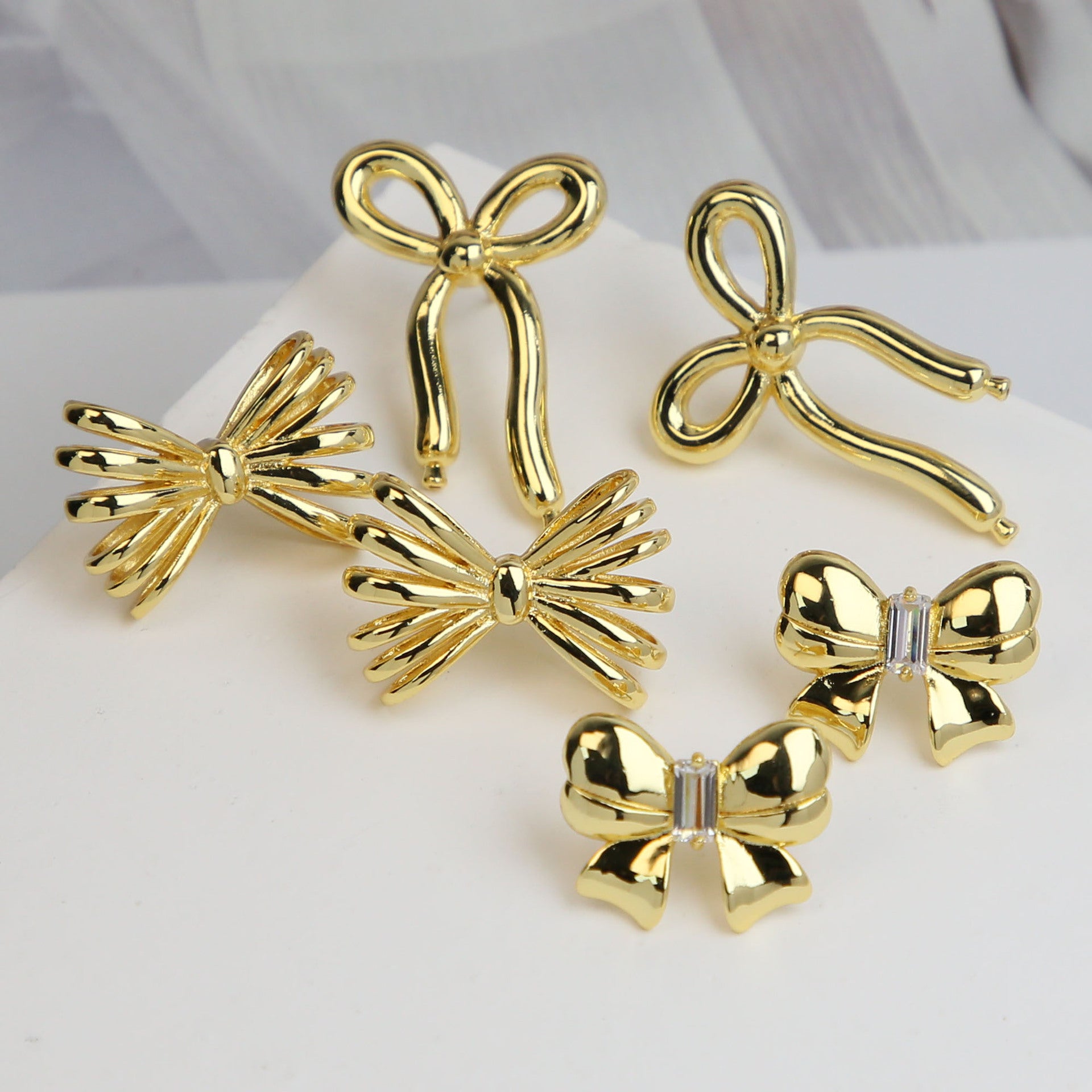 Wholesale copper plated real gold bow earrings