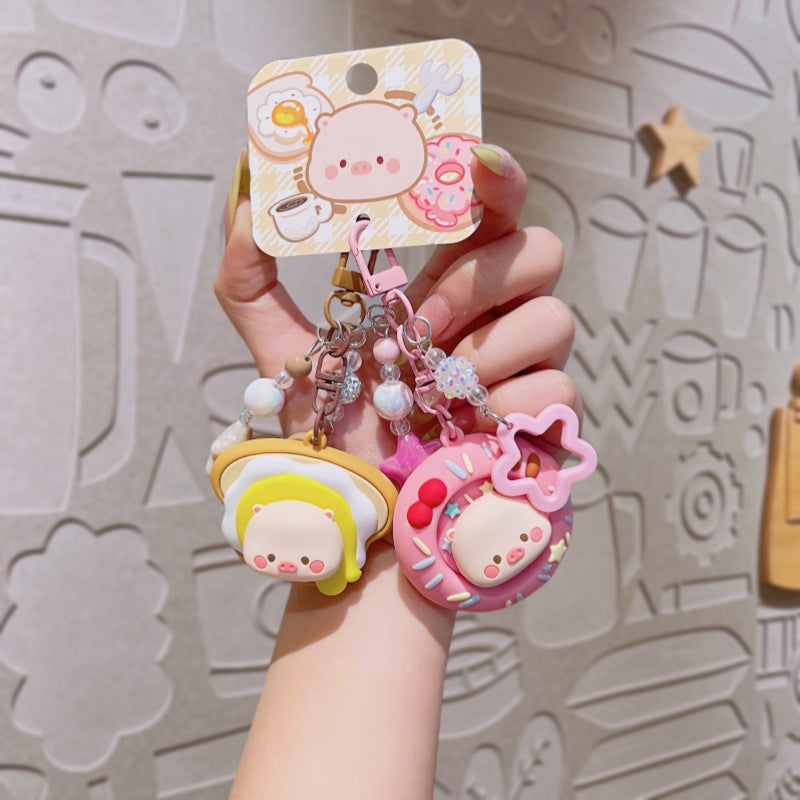 Wholesale Cute cartoon PVC pig spinning donut keychain
