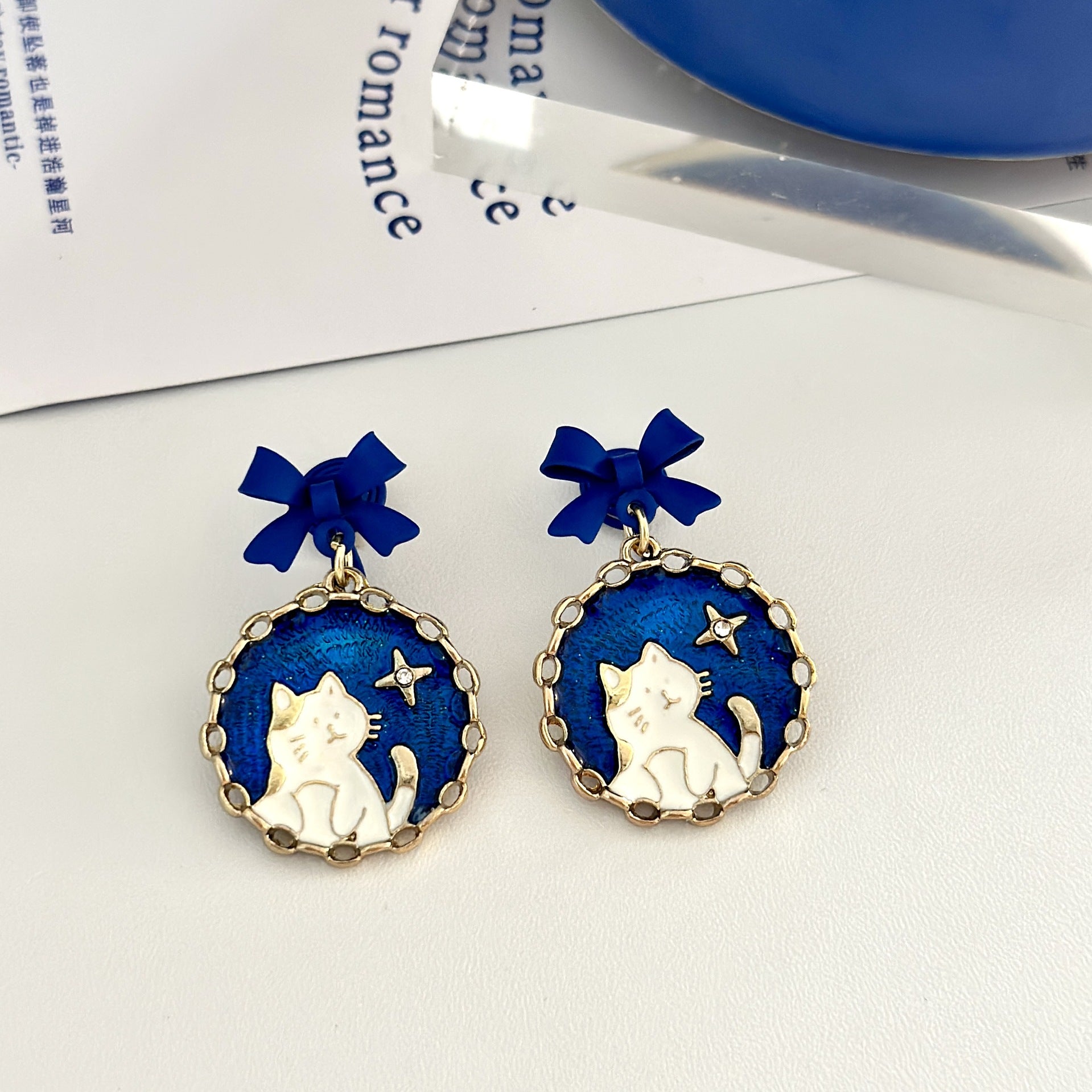 Wholesale blue bow cat earrings