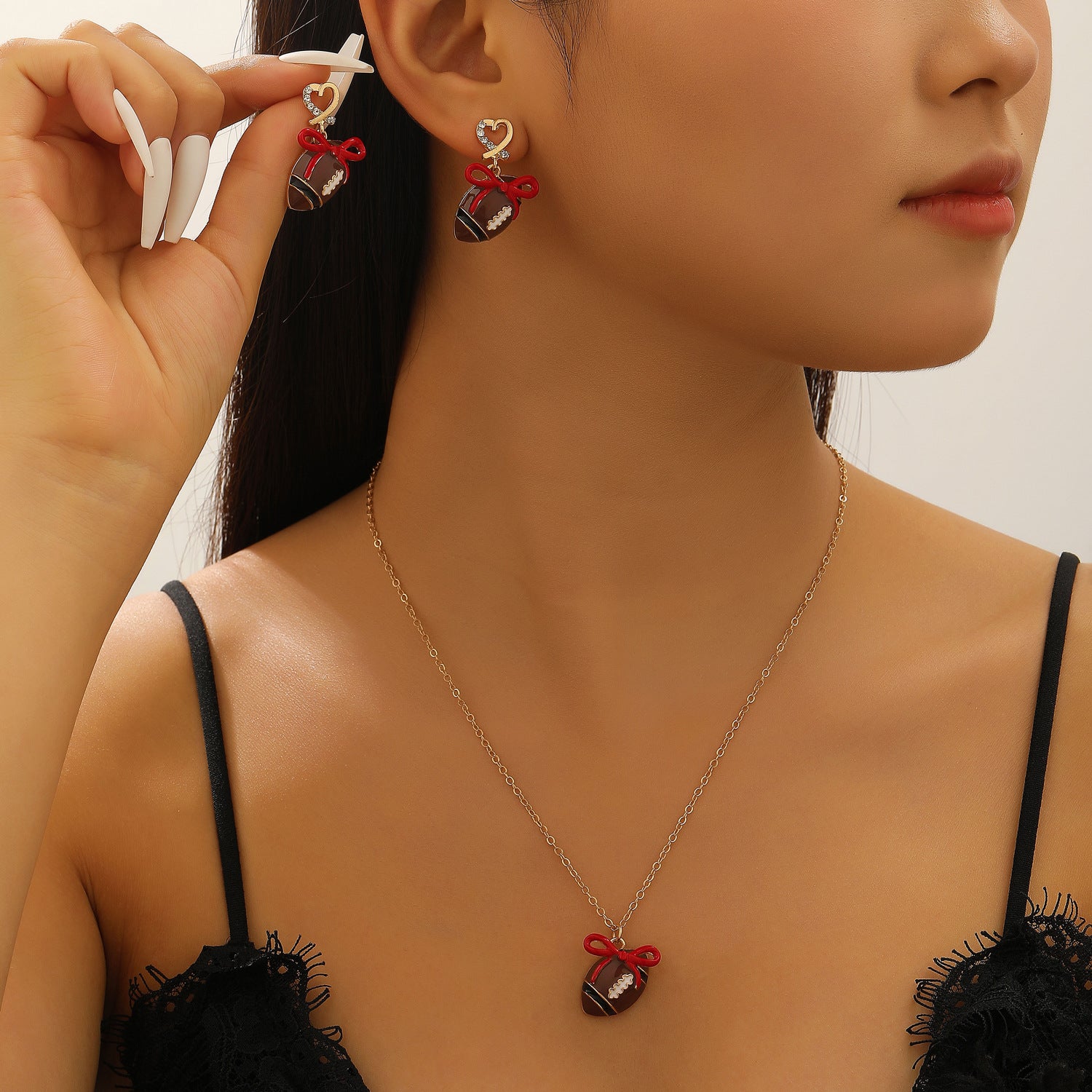 Wholesale sports style football love bow  necklace