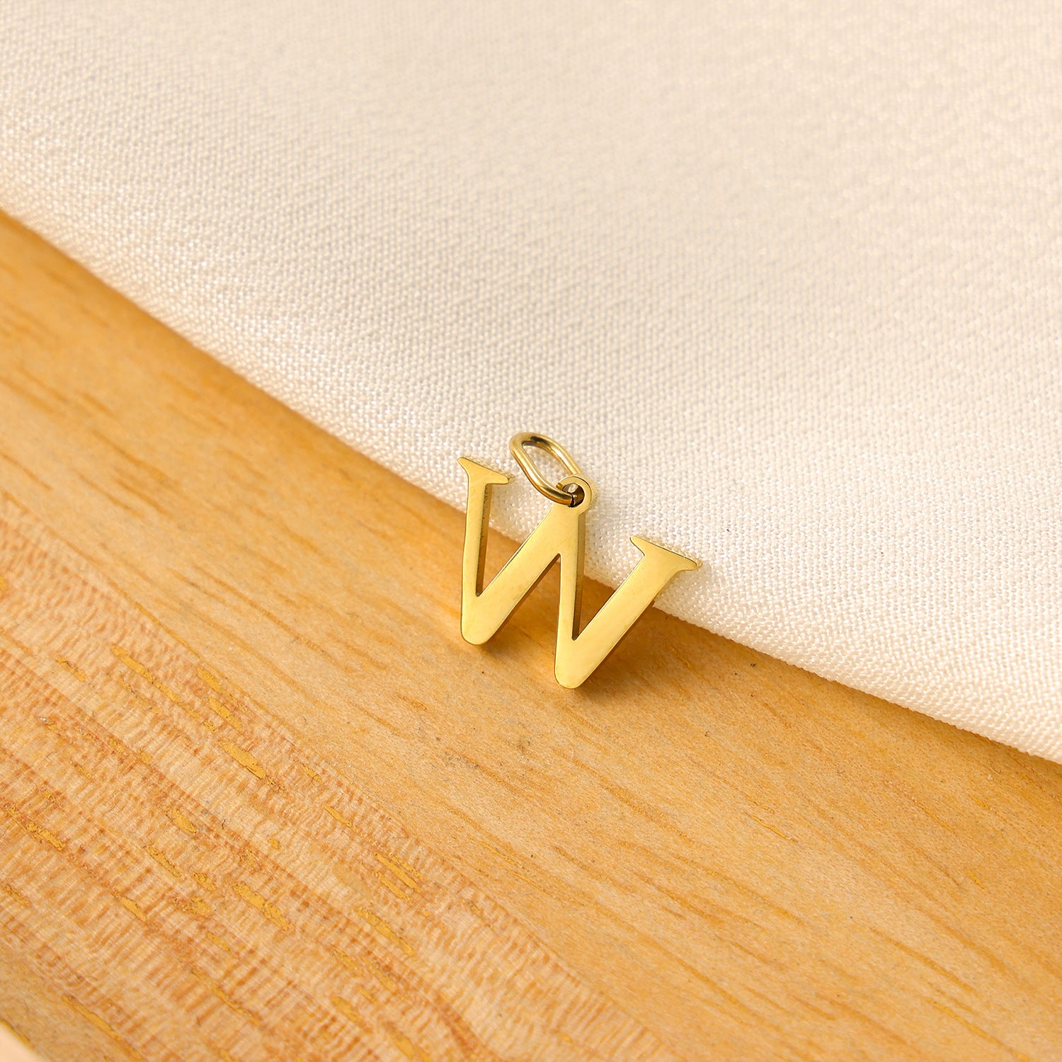 Wholesale Titanium steel letter pendant