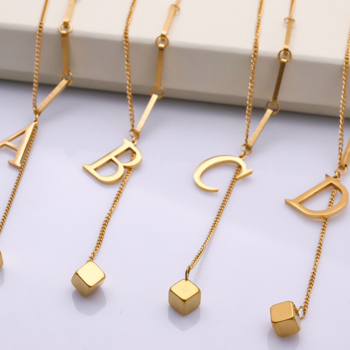 Wholesale small square 26 letter D titanium steel necklace