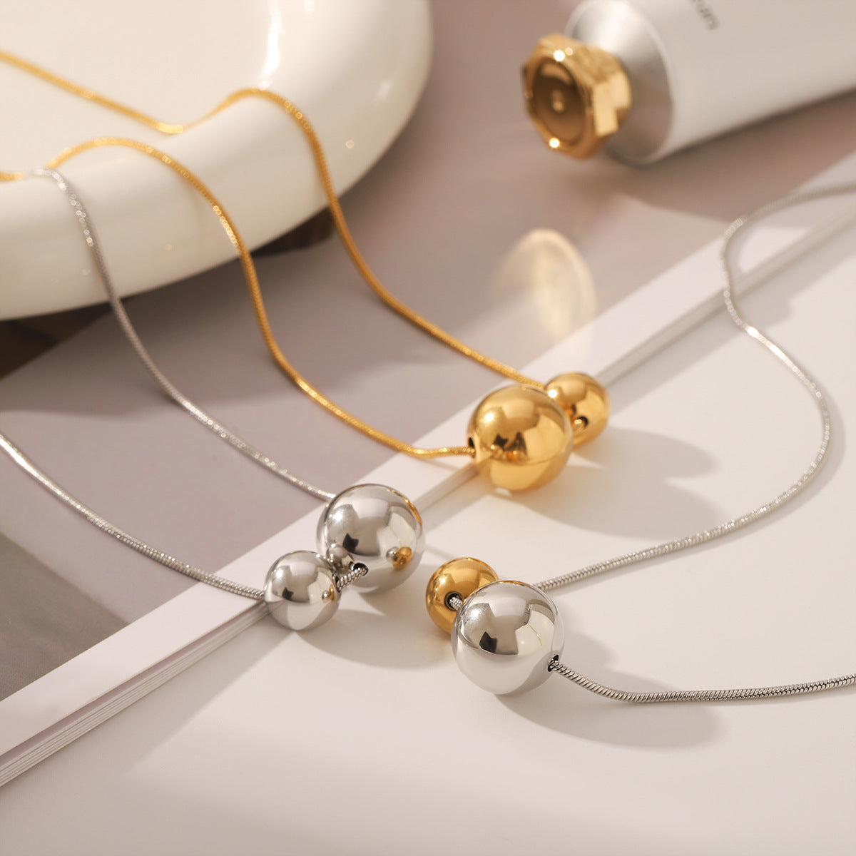 Wholesale Titanium steel necklace with gold and silver color matching round bead pendant