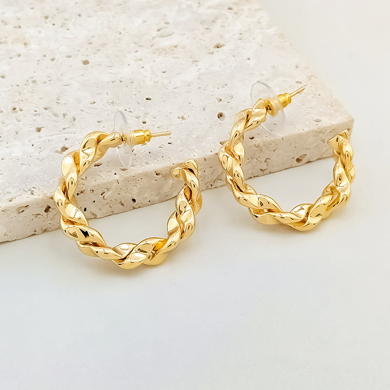 Wholesale twist earrings plain ring light luxury copper plated gold earrings