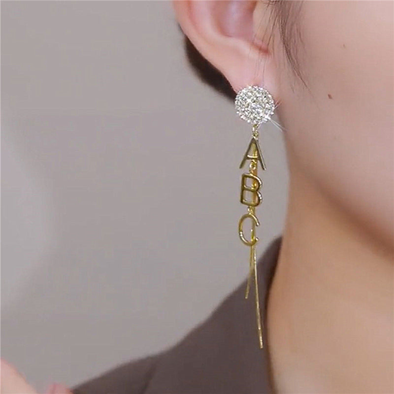 Wholesale Asymmetrical letter tassel earrings