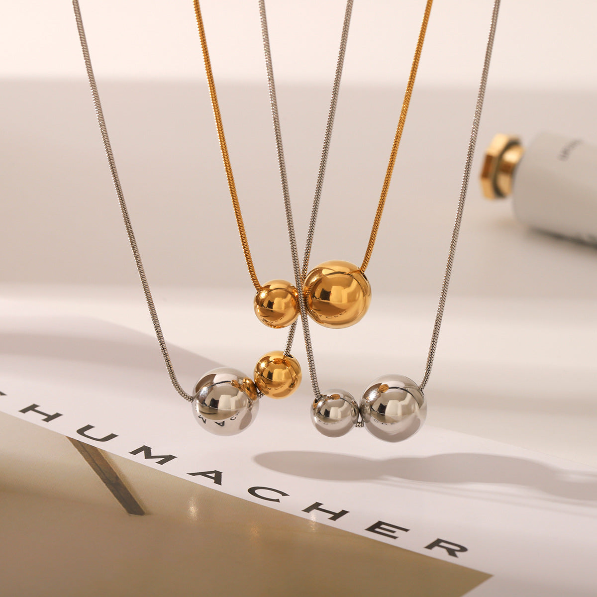 Wholesale Titanium steel necklace with gold and silver color matching round bead pendant