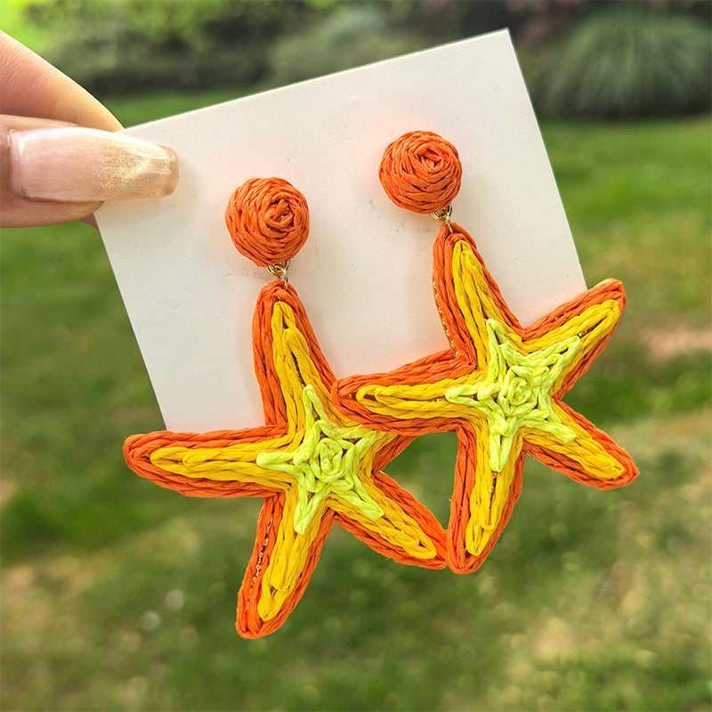 Boucles d'oreilles étoiles de mer tissées de l'herbe en gros