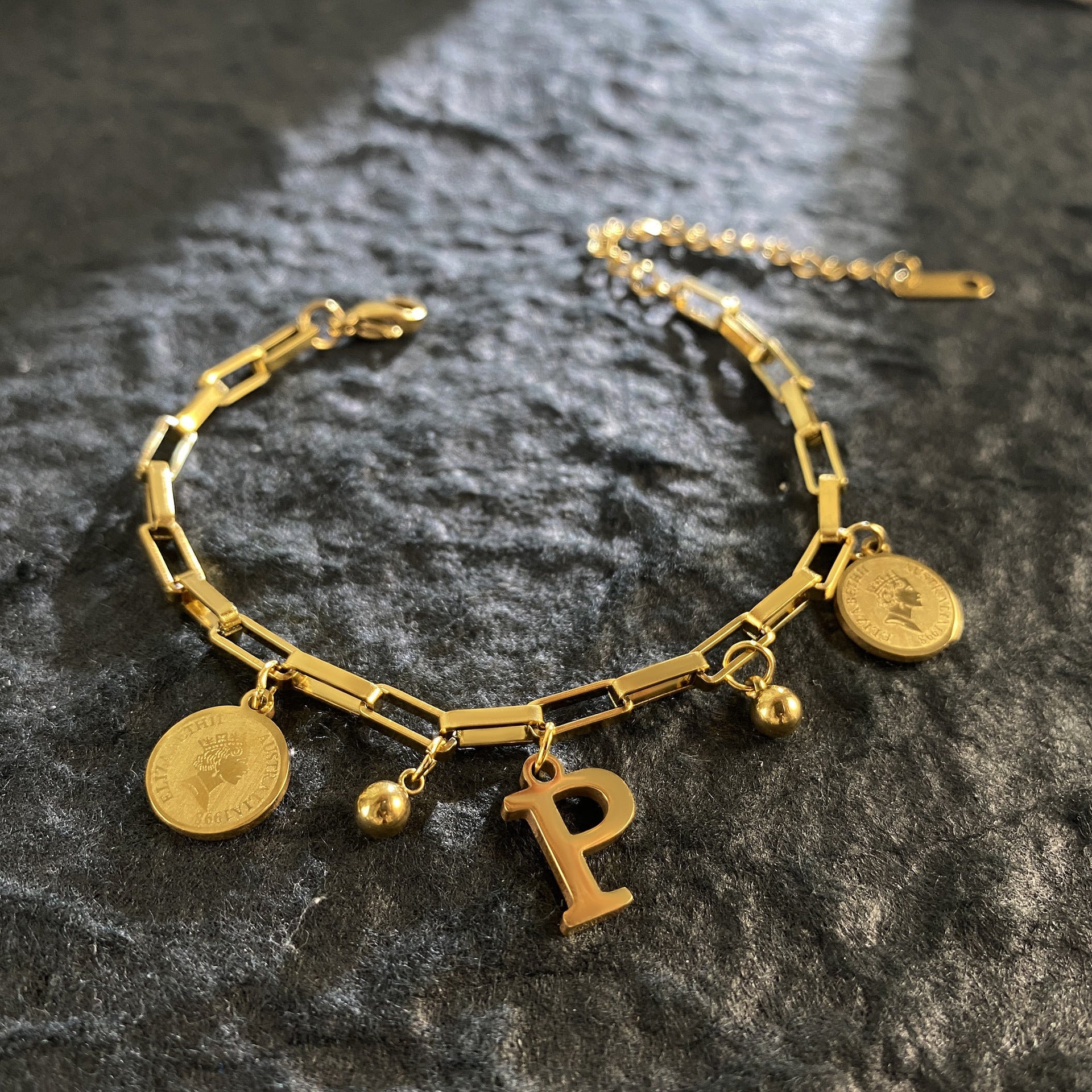 Wholesale Titanium Steel 18K Gold Plated Queen's Head Letter Bracelet ACC-BT-YuXun007