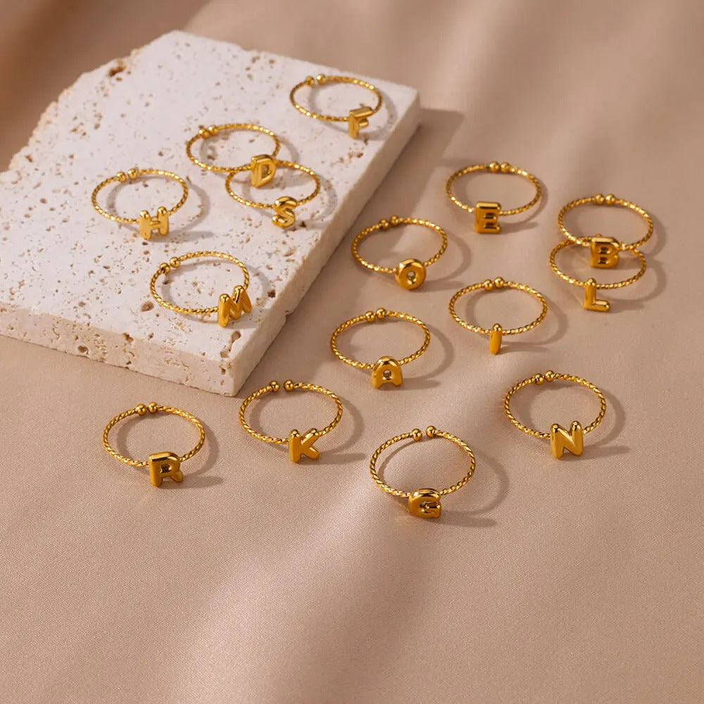 Wholesale stainless steel plated 18k real gold 26 English letter ring