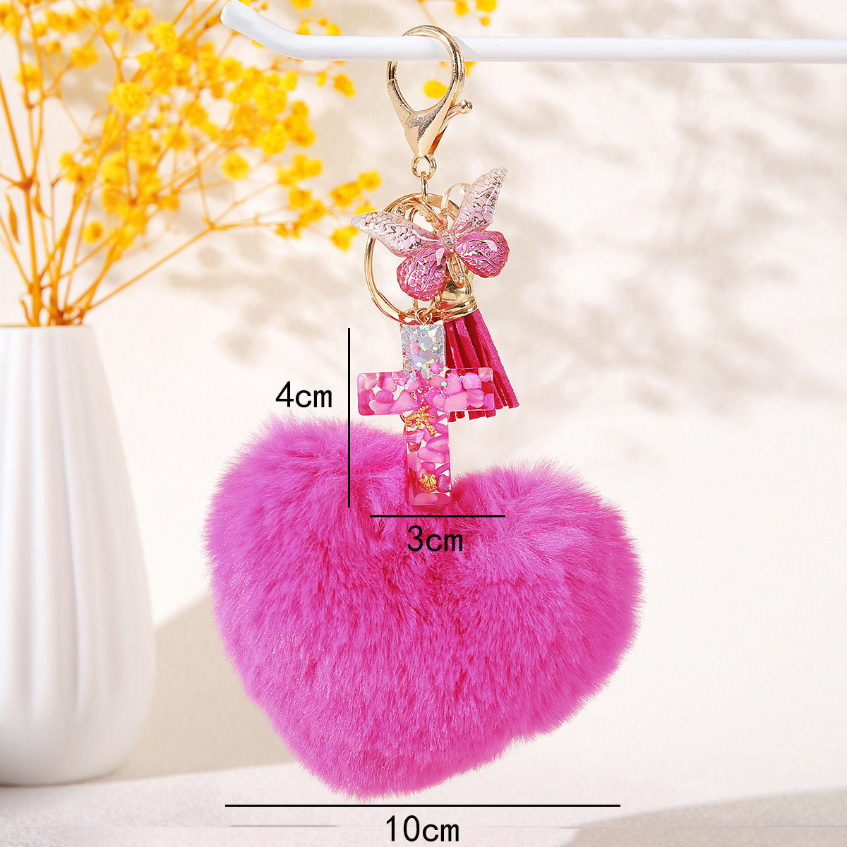 Wholesale Resin butterfly cross keychain with heart-shaped pom-pom