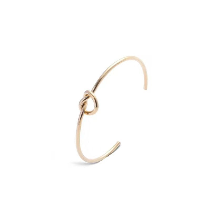 Bracciale semplice a forma di C annodato con amore in acciaio inossidabile all'ingrosso