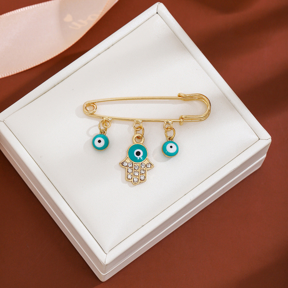 Wholesale Diamond-encrusted Devil' s Eye Tassel Brooch