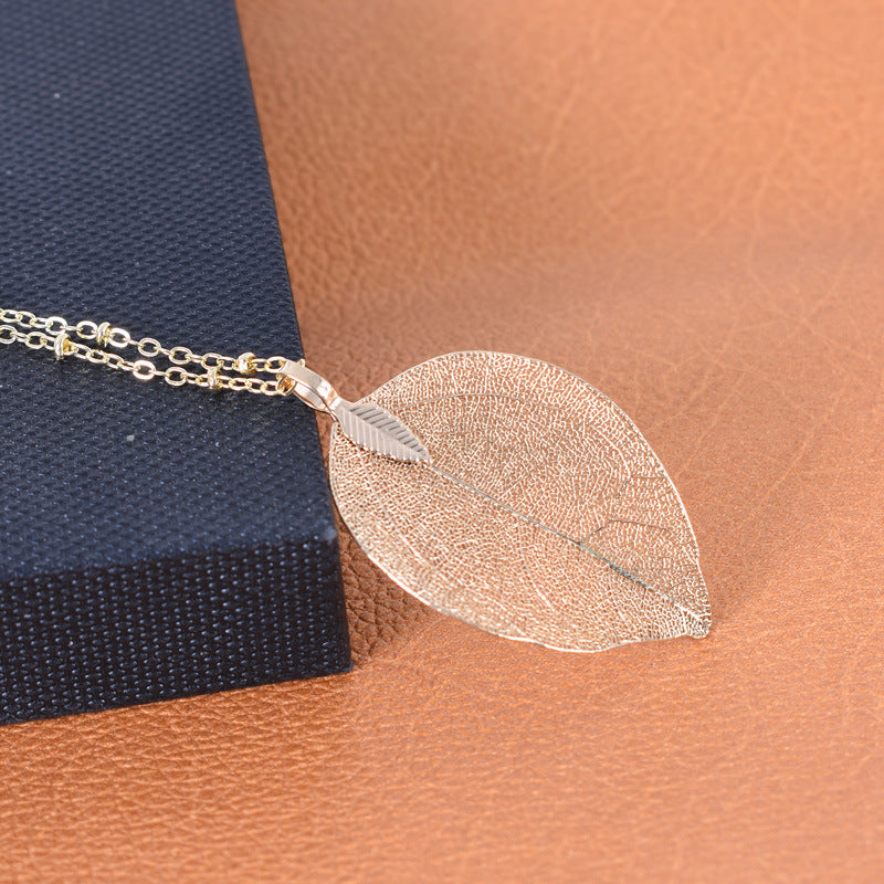 Wholesale simple hollow leaf sweater chain