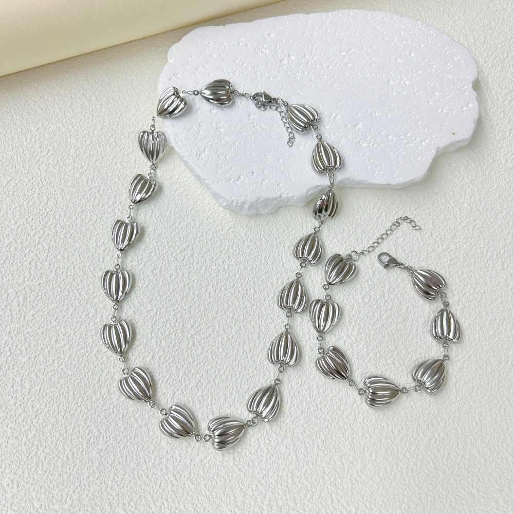 Wholesale Stainless Steel Three-dimensional Hollow Love Bracelet Necklace suit