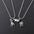 Wholesale Titanium Steel Magnetic Astronaut Couple Necklace