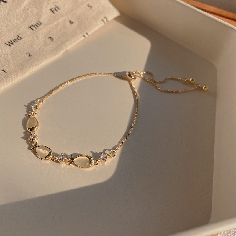 Wholesale Copper cat' s eye stone fish bracelet