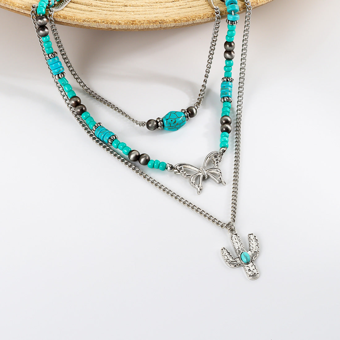 Großhandel Retro türkiser Schmetterlings Schlüsselblattkette Ethnische Kaktuskette