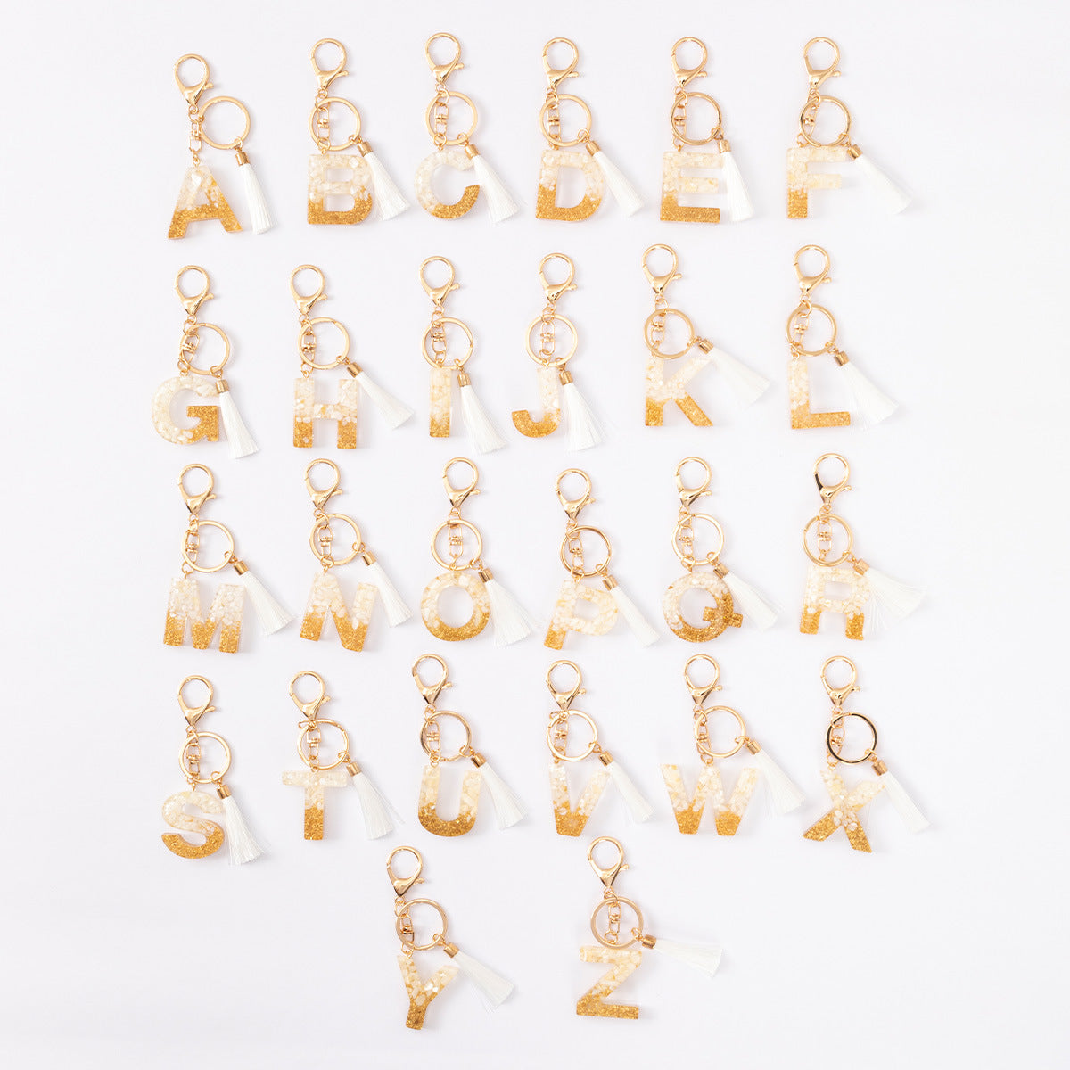 Wholesale Gold Foil New Resin Crystal Glue White Tassel Color English Digital Keychain