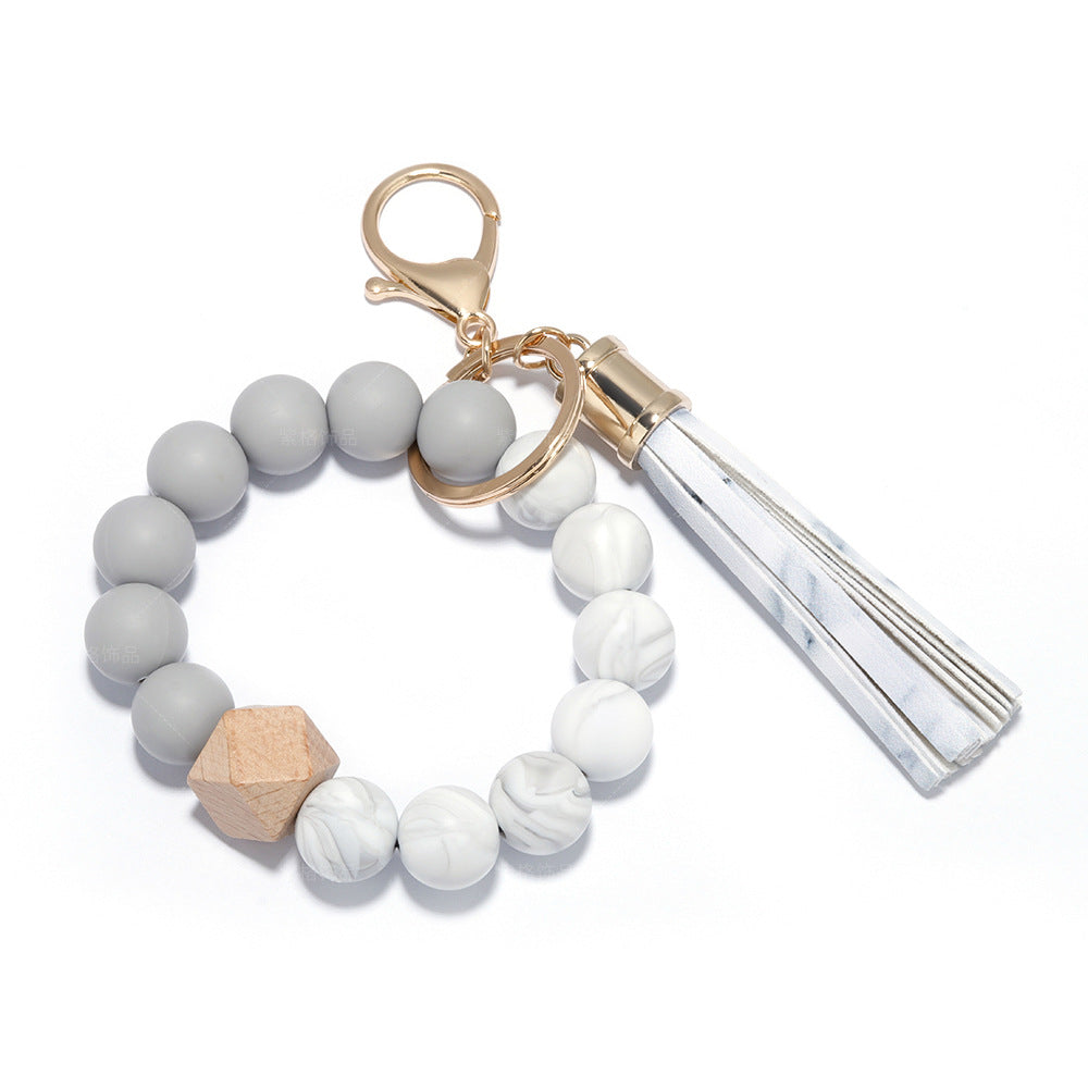 Porte-clés de bracelet en gros, pompon en cuir perlé PU en Silicone