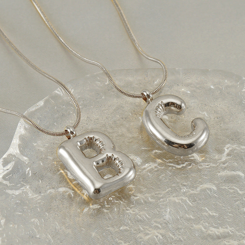 Großhandel Titanium Stahlblasenbuchstaben Halskette Schlangenknochenkette