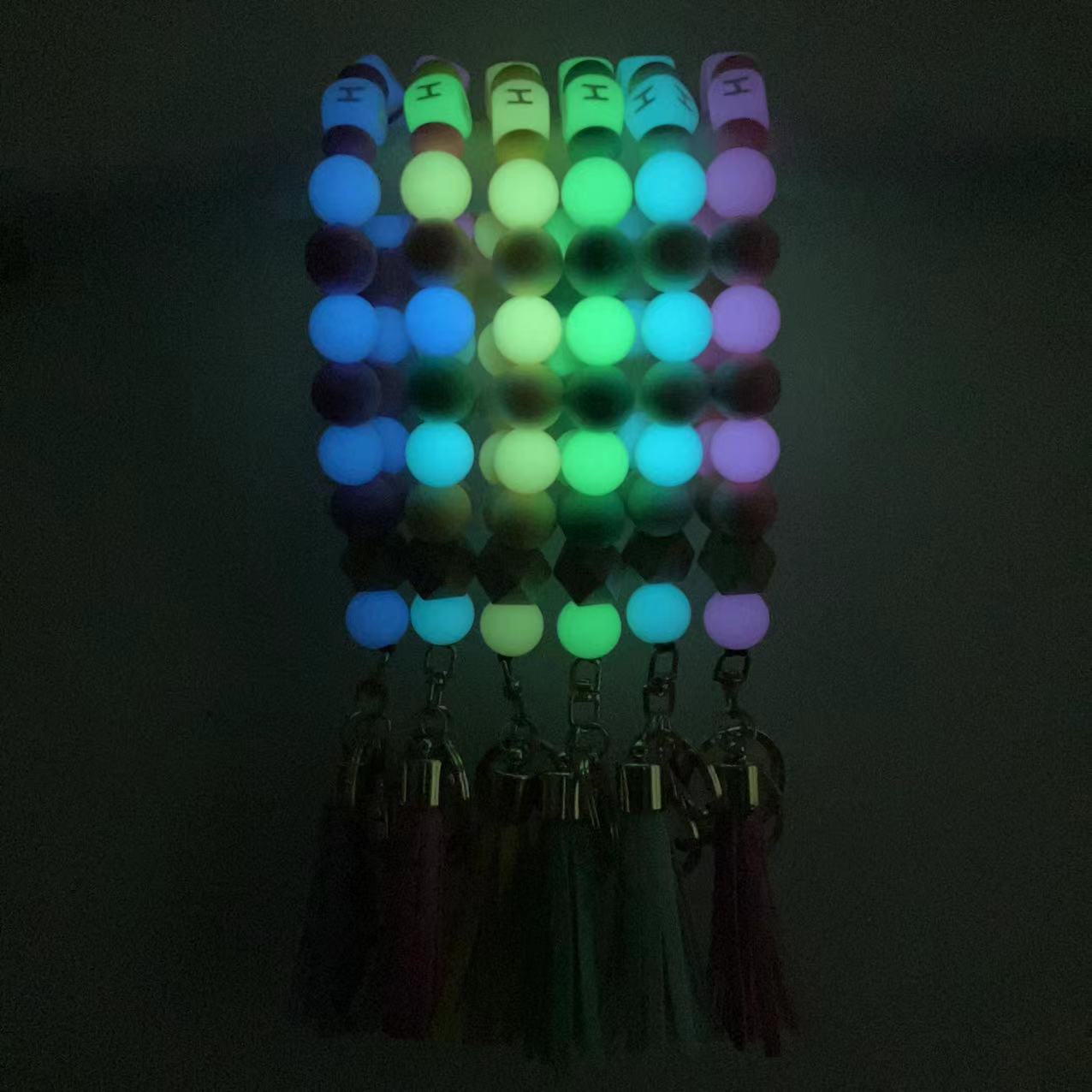 Wholesale Silicone Glow In The Dark Bead Bracelet Keychain With PU Tassels Trendy Car Key Bag Charm Accessory