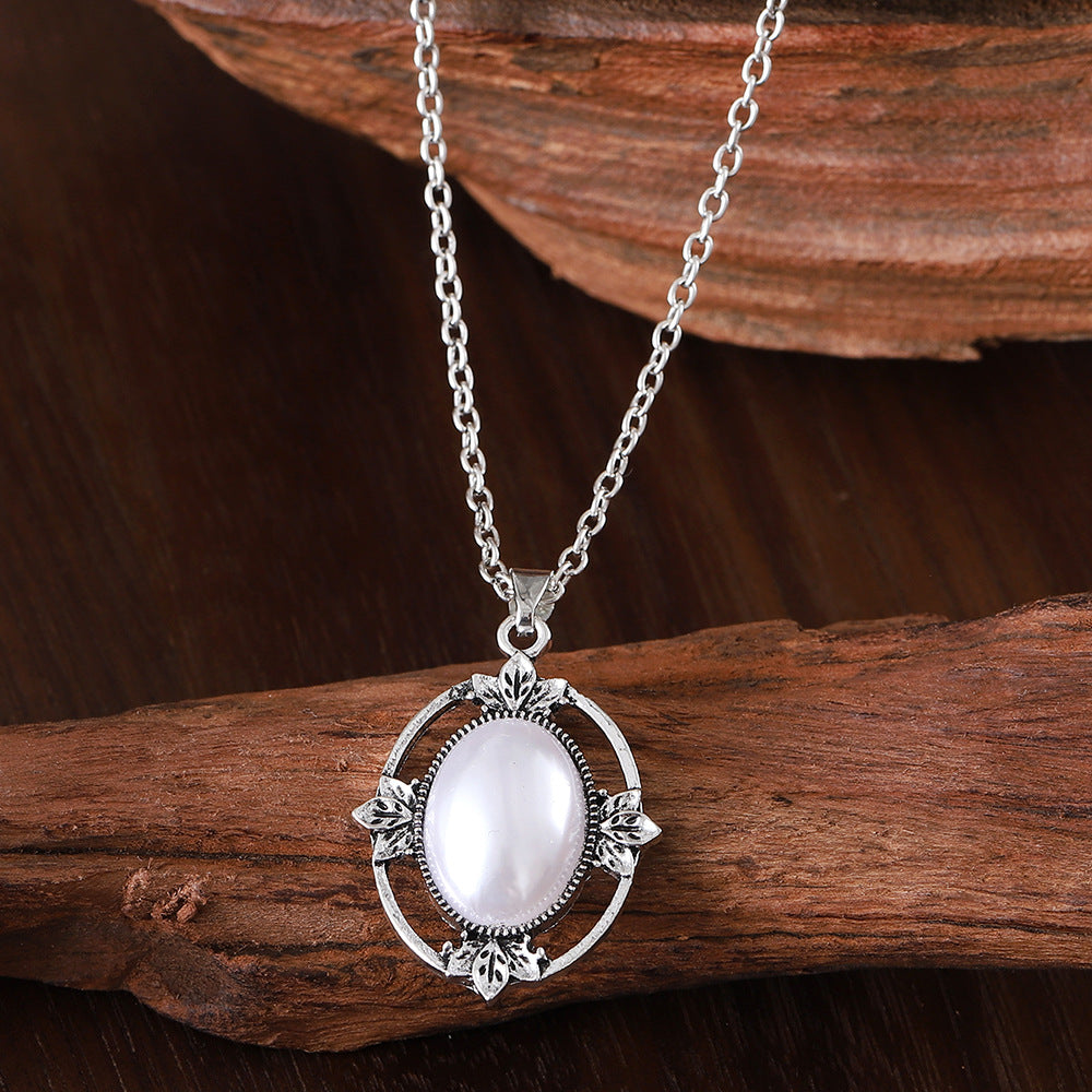 Wholesale Retro Hollow Bohemian Style Inlaid Oval Pearl Alloy Pendant Necklace