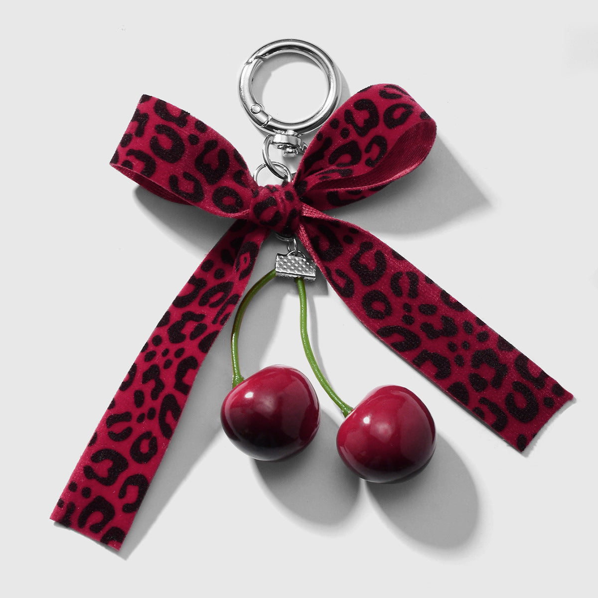Wholesale Zinc alloy artificial pearl lace leopard print bowknot cherry keychain