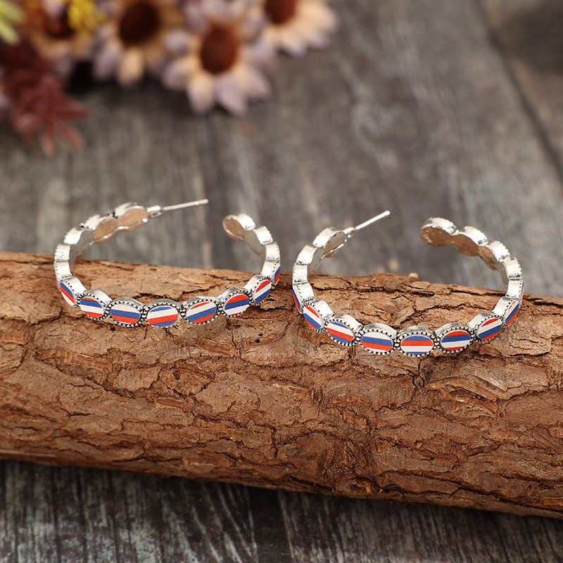 Wholesale American Independence Day C-shaped inlaid acrylic blue,white and red striped alloy earrings