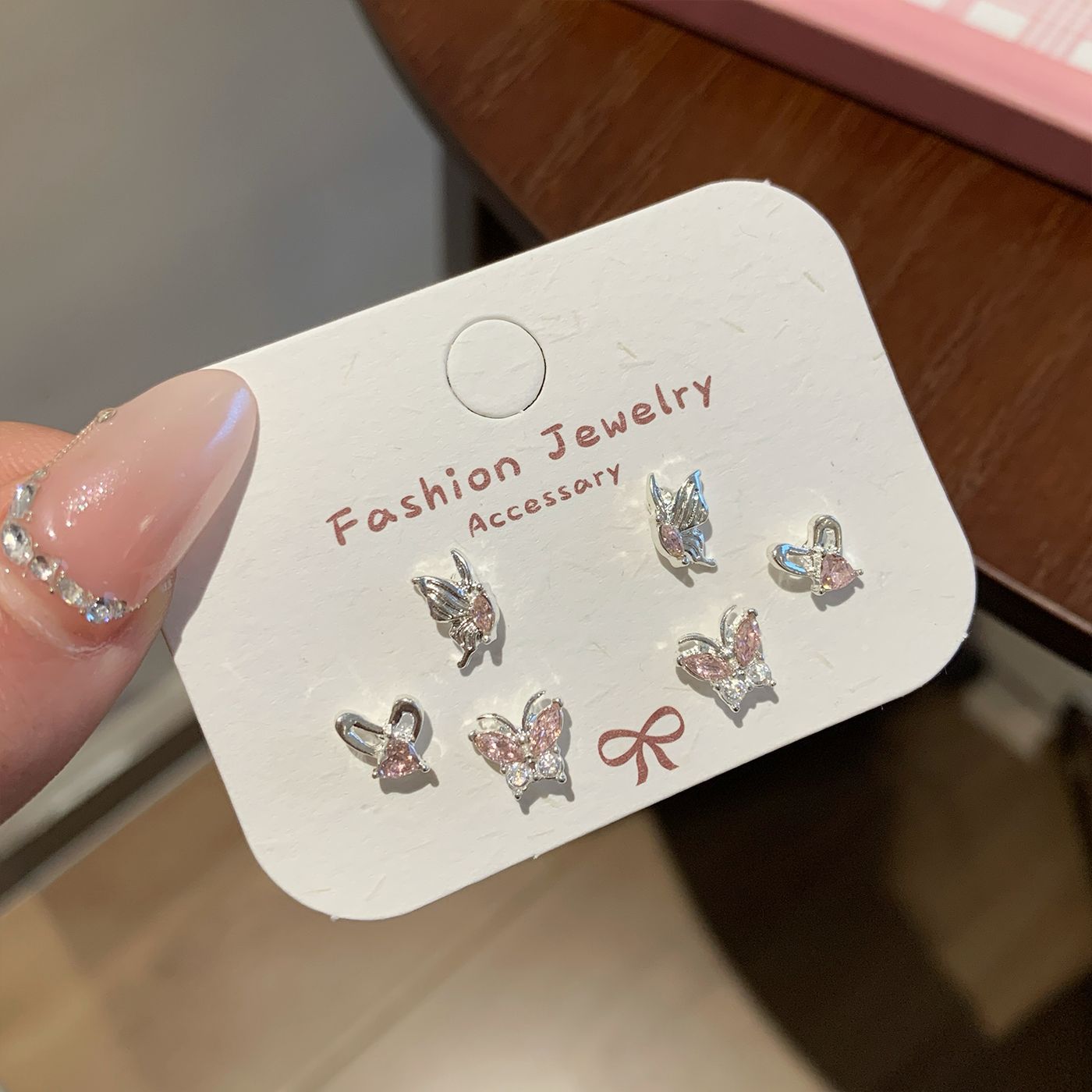Wholesale Sweet and cool pink zircon butterfly earrings silver needle small daily sparkling all-match earrings