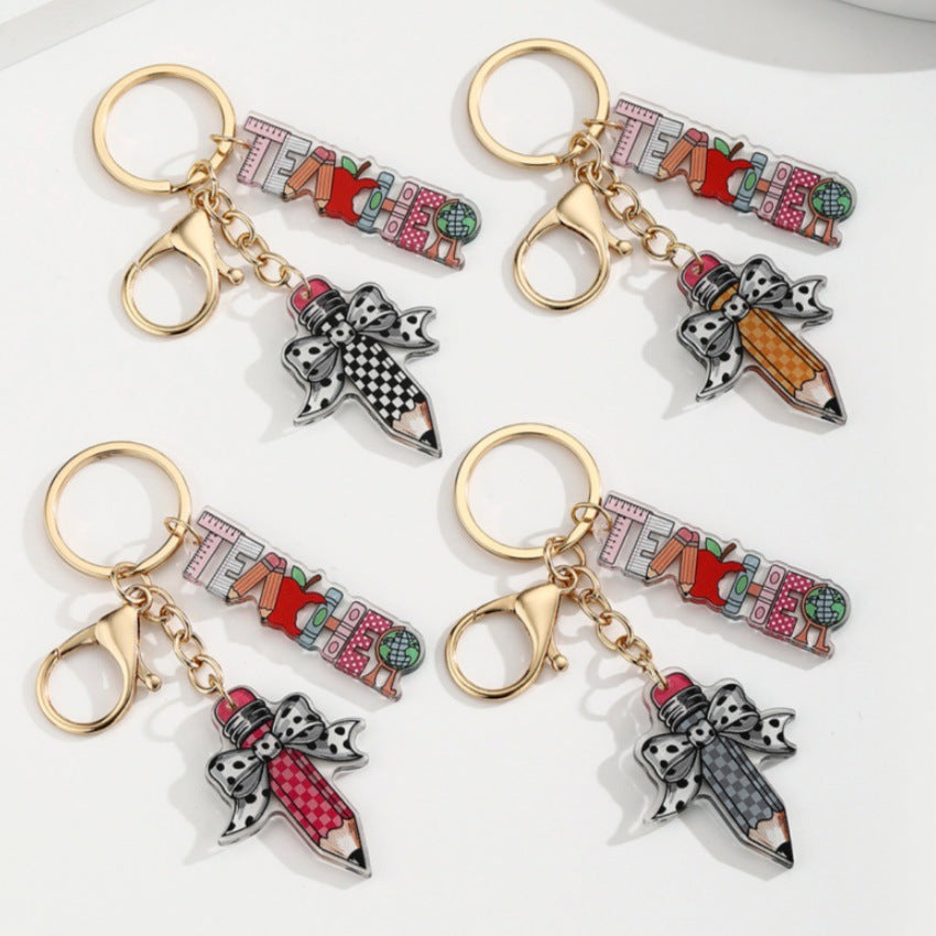 Wholesale acrylic bow pencil letter strip keychain pendant