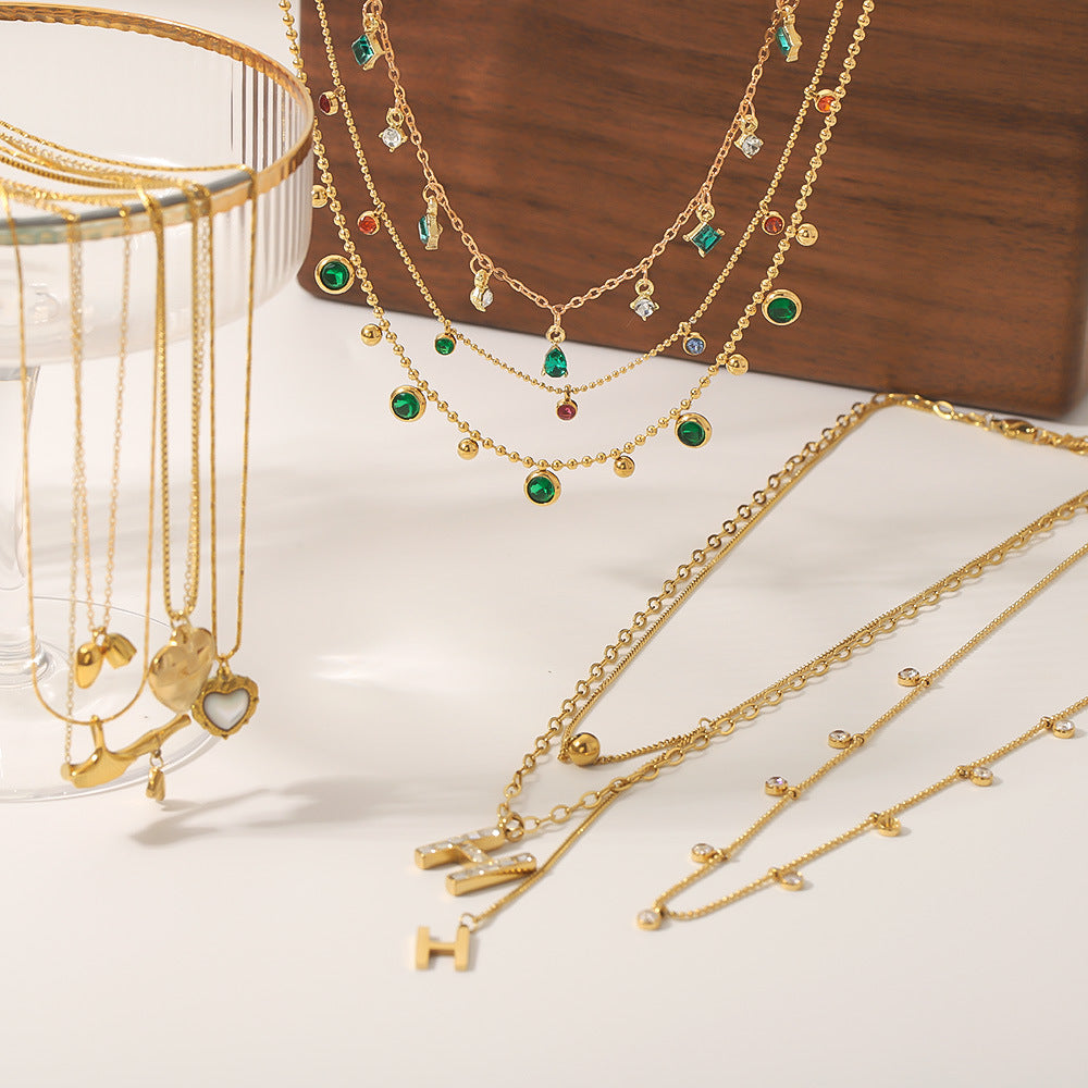 Wholesale stainless steel bamboo love fishtail skirt letter zircon necklace