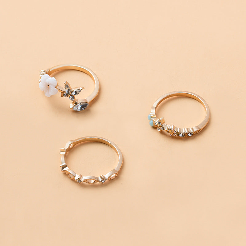 Wholesale fashion alloy opening colored diamond flower hollow ring suit