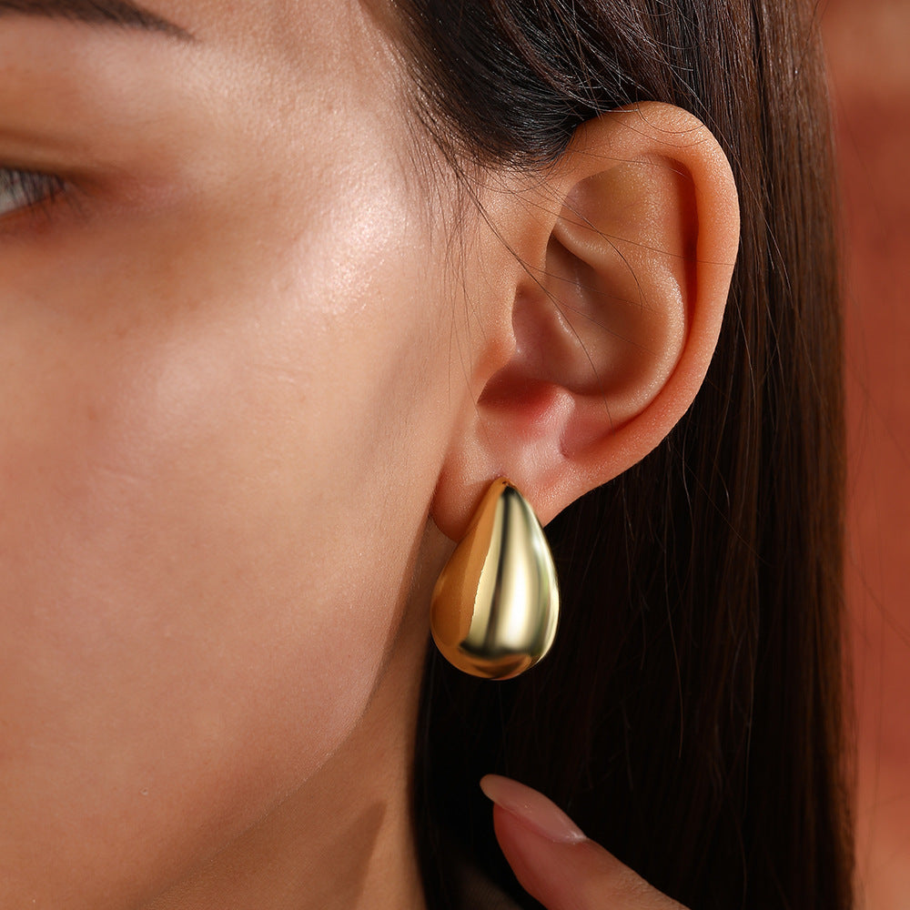 Wholesale Copper plated 18 gold hollow glossy water drop stud earrings