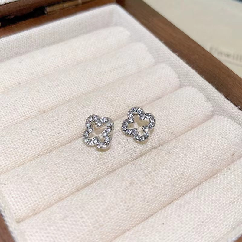 Wholesale silver needle diamond leaf hollow earrings