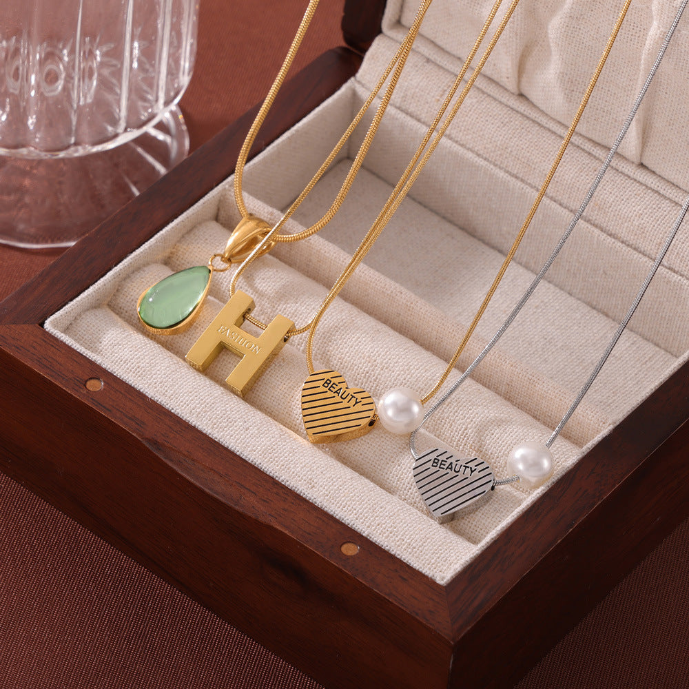 Wholesale Retro Love Water Drop Glass Stone Pendant Titanium Steel Gold Plated Necklaces ACC-NE-OMK007