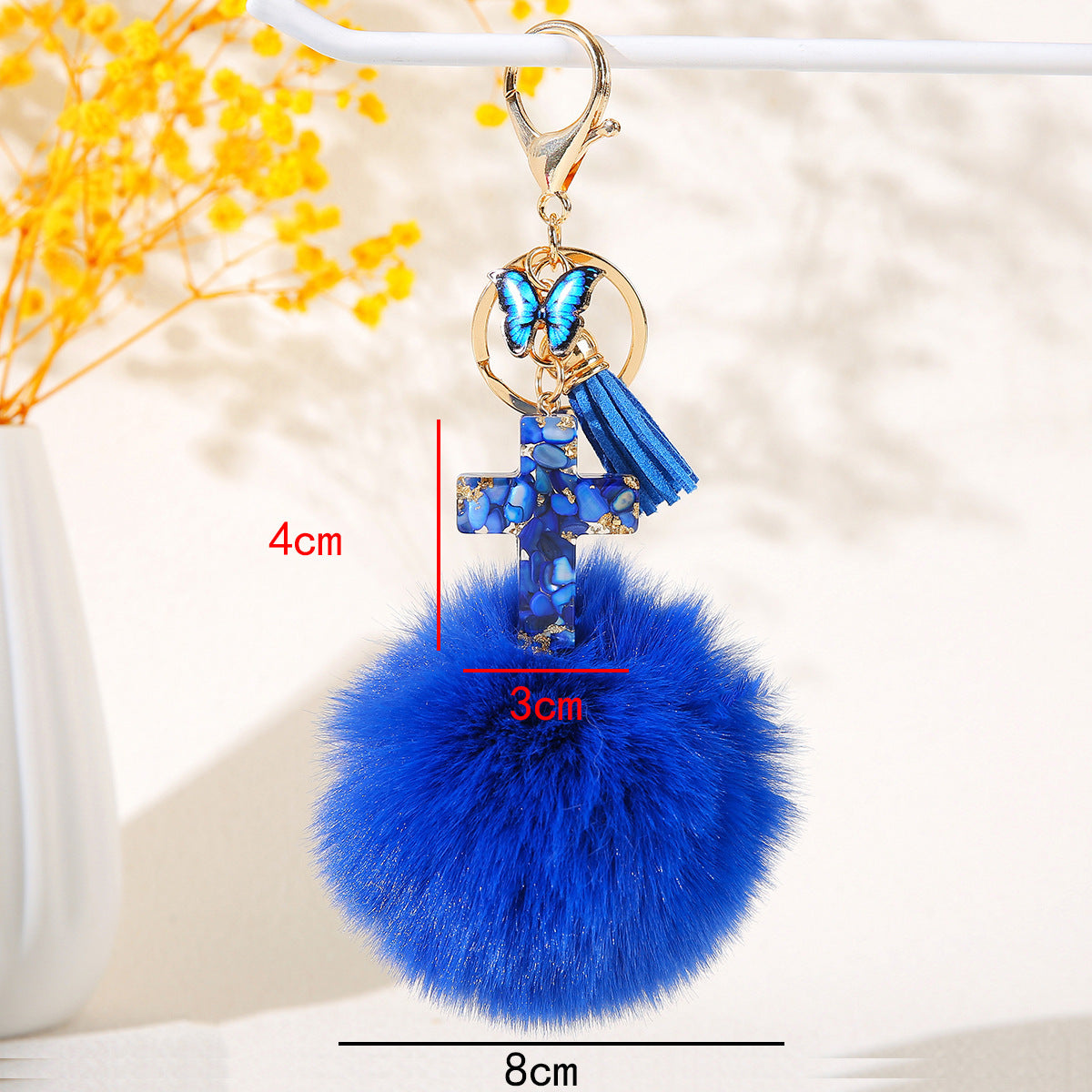 Wholesale Resin butterfly cross keychain with heart-shaped pom-pom