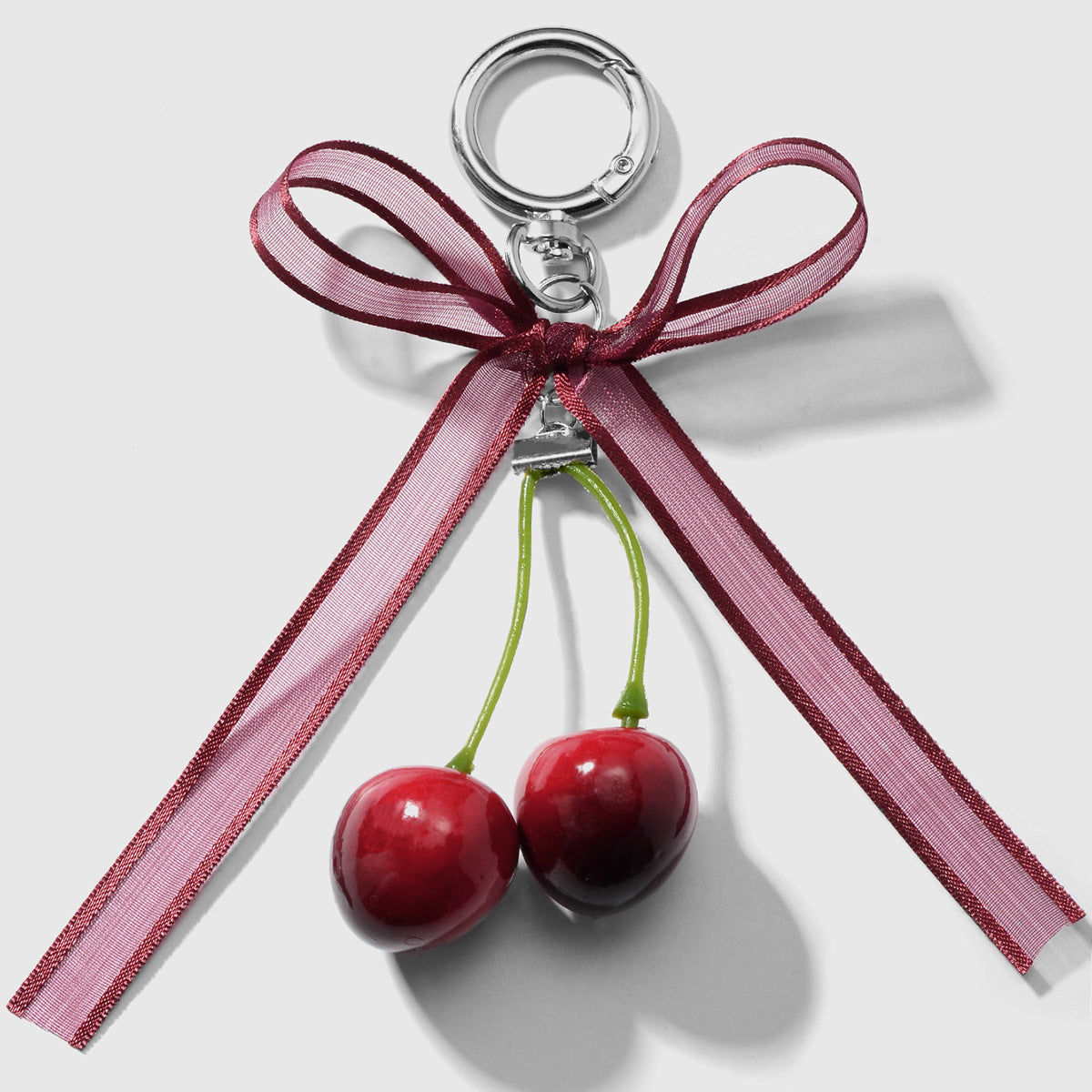 Wholesale Zinc alloy artificial pearl lace leopard print bowknot cherry keychain