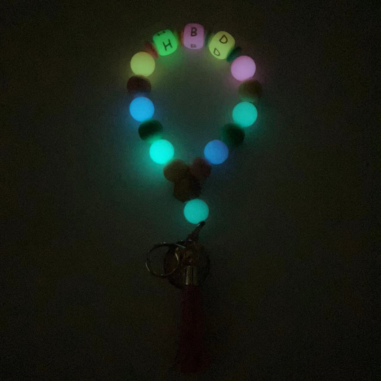 Wholesale Silicone Glow In The Dark Bead Bracelet Keychain With PU Tassels Trendy Car Key Bag Charm Accessory