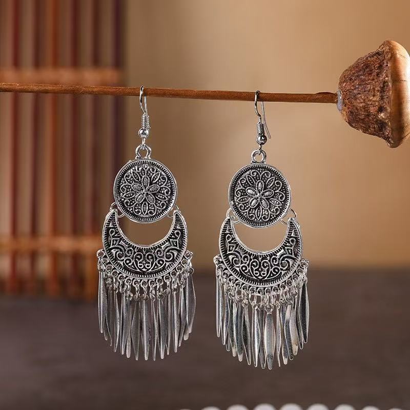 Wholesale Bohemian hollow  carved long tassel earrings