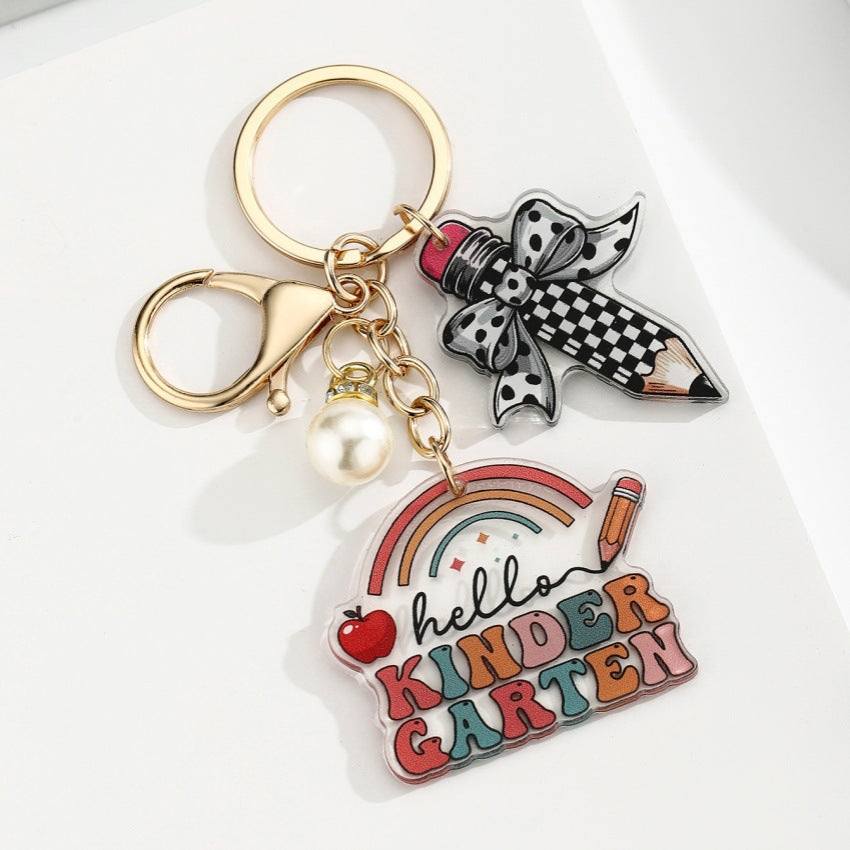 Portachiavi a matita con slogan e lettera di perle di libro acrilico all'ingrosso